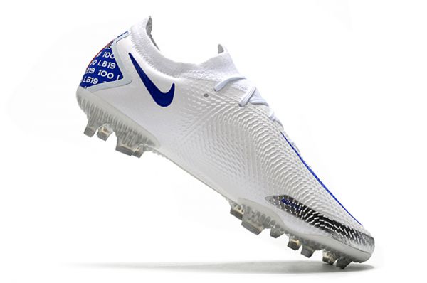 white and blue nike cleats